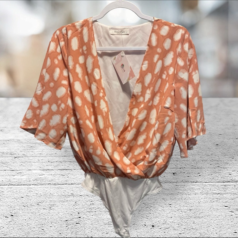 NWT Westeria Lane Surplice Animal Print - Coral BodySuit